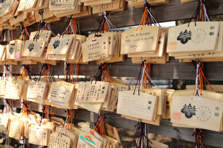 People wrote their wishes on the wooden tag and hung them at the shrine.