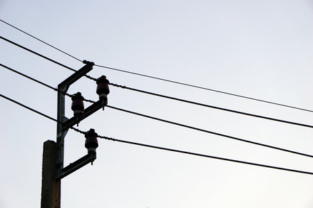 Looking at the electric poles and wires in front of my house in the evening