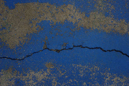 The shadow of the old cement  wall surface with cracks , texture , backgrounds for designの写真素材