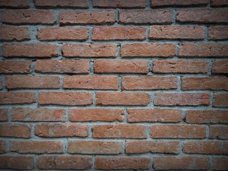 The orange concrete and brick block walls are perfect for a design backgroundの写真素材