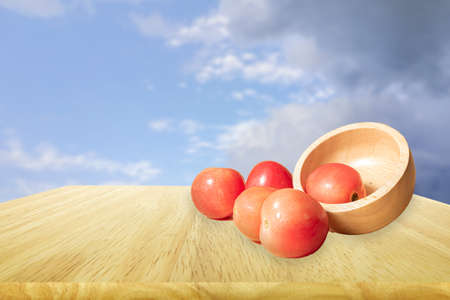 Tomatoes placed on the tableの写真素材