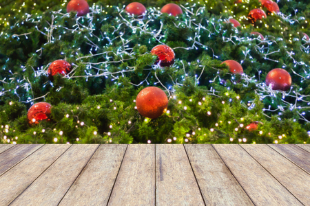 wood floor with decorations on the Christmas tree, Christmas blurred backgroundの写真素材
