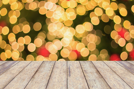 Christmas Light Bokeh background with wood floorの写真素材