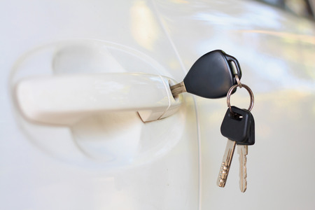 Car keys left in the car doorの写真素材