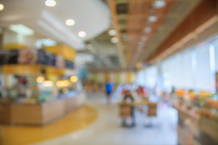 abstract blurred background of people in food court and coffee shopの写真素材