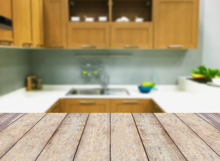 Wooden table on modern kitchen interior backgroundの写真素材
