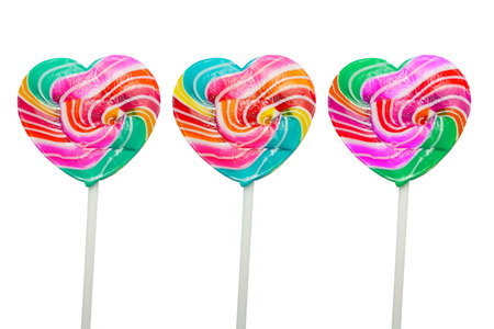 colorful heart lollipops isolated on a white backgroundの写真素材