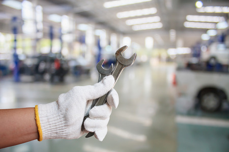 Hand of professional Auto mechanic with wrench, Auto repair serviceの写真素材