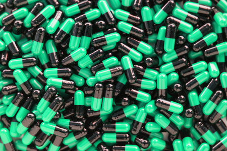 Many medicines pills capsules backgroundの写真素材