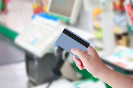 Paying credit card for purchases at the supermarketの写真素材