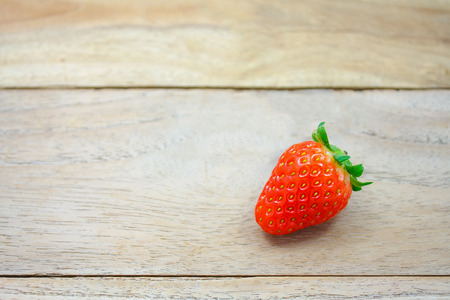 Fresh strawberries on wooden backgroundの写真素材