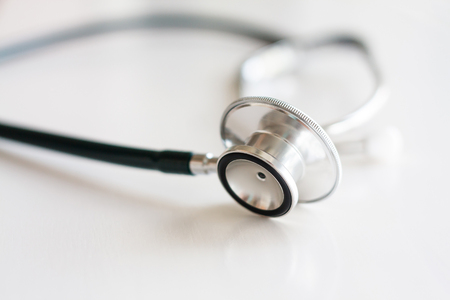 Stethoscope on white wooden backgroundの写真素材