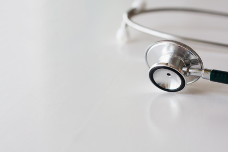 Stethoscope on white wooden backgroundの写真素材