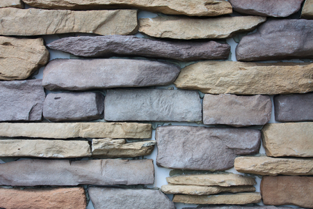 pattern of decorative slate stone wall background textureの写真素材