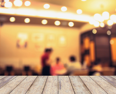 wood counter with blurred background made with Vintage Tones,Coffee shop blur background with bokehの写真素材
