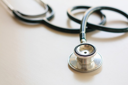 Stethoscope on white wooden backgroundの写真素材