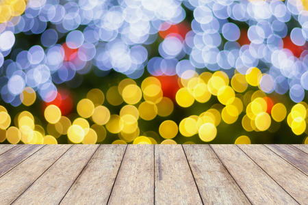 Christmas Light Bokeh background with wood floorの写真素材
