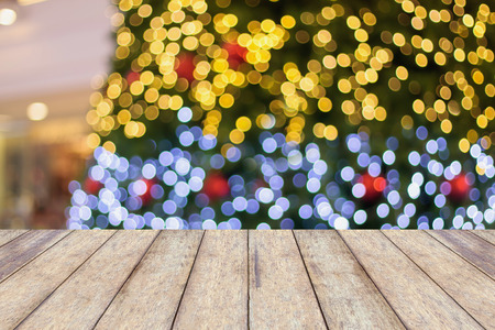 wood floor with decorations on the Christmas tree, Christmas blurred backgroundの写真素材