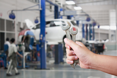 Hand of professional Auto mechanic with wrench, Auto repair serviceの写真素材