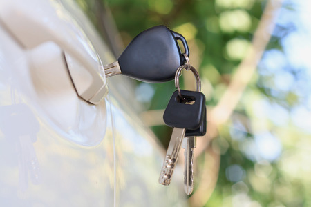 Car keys left in the car doorの写真素材