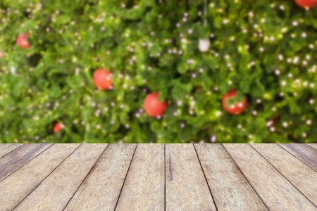 wood floor with decorations on the Christmas tree, Christmas blurred backgroundの写真素材