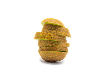 fresh ripe kiwi fruit slices in stack isolated on white backgroundの写真素材