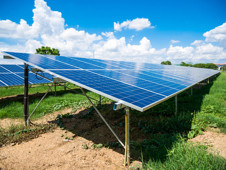 Solar panels with blue sky and clouds, solar energy environmentally friendly green energyの写真素材