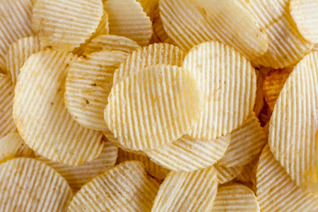 Potato chips background close upの写真素材