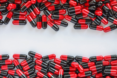 Many medicines pills capsules backgroundの写真素材