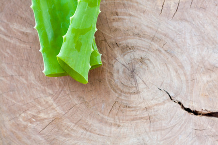 Fresh Aloe vera leaf on wooden backgroundの写真素材