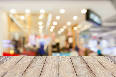 Empty table and blur clothing store with bokeh background, product displayの写真素材
