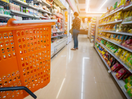 empty basket on shopping cart in supermarket or convenience storeの写真素材