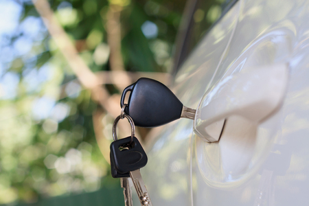 Car keys left in the car doorの写真素材