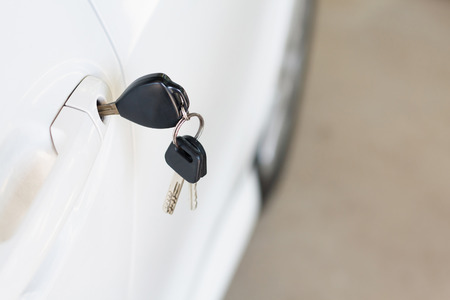 Car keys left in the car doorの写真素材