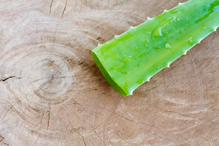 Fresh Aloe vera leaf on wooden backgroundの写真素材