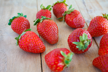 Fresh red strawberries on wooden tableの写真素材