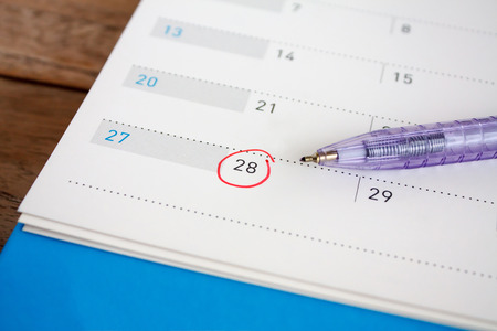 Red circle mark on the calendar at 28thの写真素材