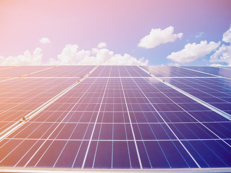 Solar panels with blue sky and clouds, solar energy environmentally friendly green energy
