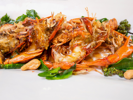 Thai food, deep fried prawns in tamarind sauce with herbの写真素材