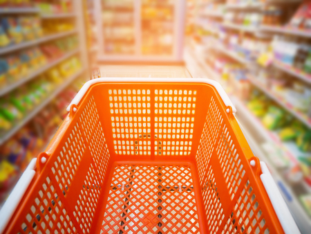 empty basket on shopping cart in supermarket or convenience storeの写真素材
