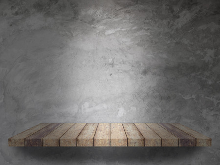 wood shelf with cement wall texture for backgroundの写真素材