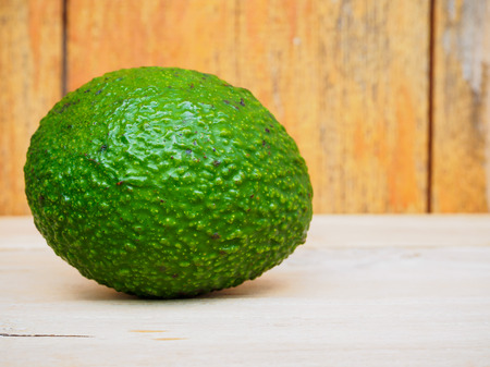 fresh organic avocado on wooden tableの写真素材