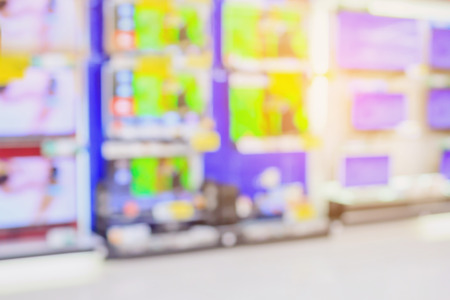 eletronic department store with Television shelves blurred backgroundの写真素材
