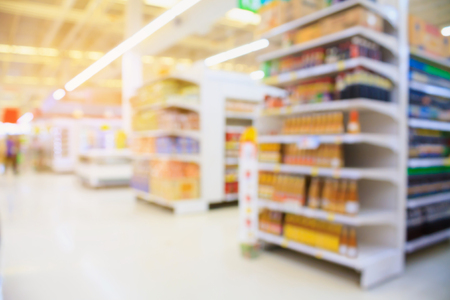 Supermarket interior blur background with customersの写真素材