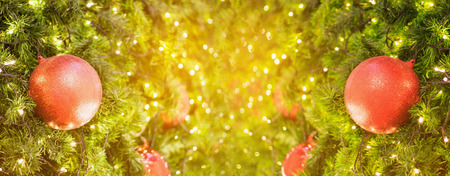 Christmas background with decorations on christmas tree with bokeh light and copy spaceの写真素材