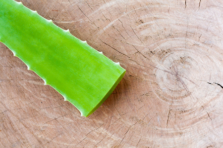 Fresh Aloe vera leaf on wooden backgroundの写真素材