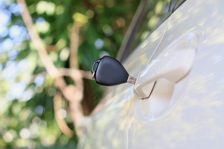 Car keys left in the car doorの写真素材