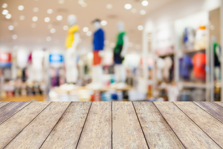 Empty table and blur clothing store with bokeh background, product displayの写真素材