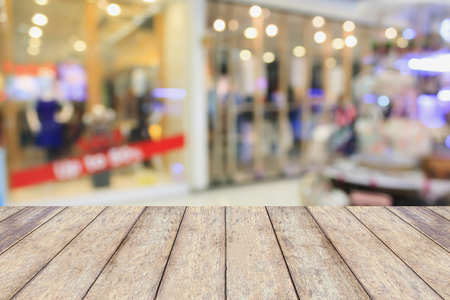 Empty table and blur clothing store with bokeh background, product displayの写真素材