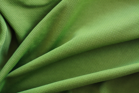 crumpled green fabric texture backgroundの写真素材